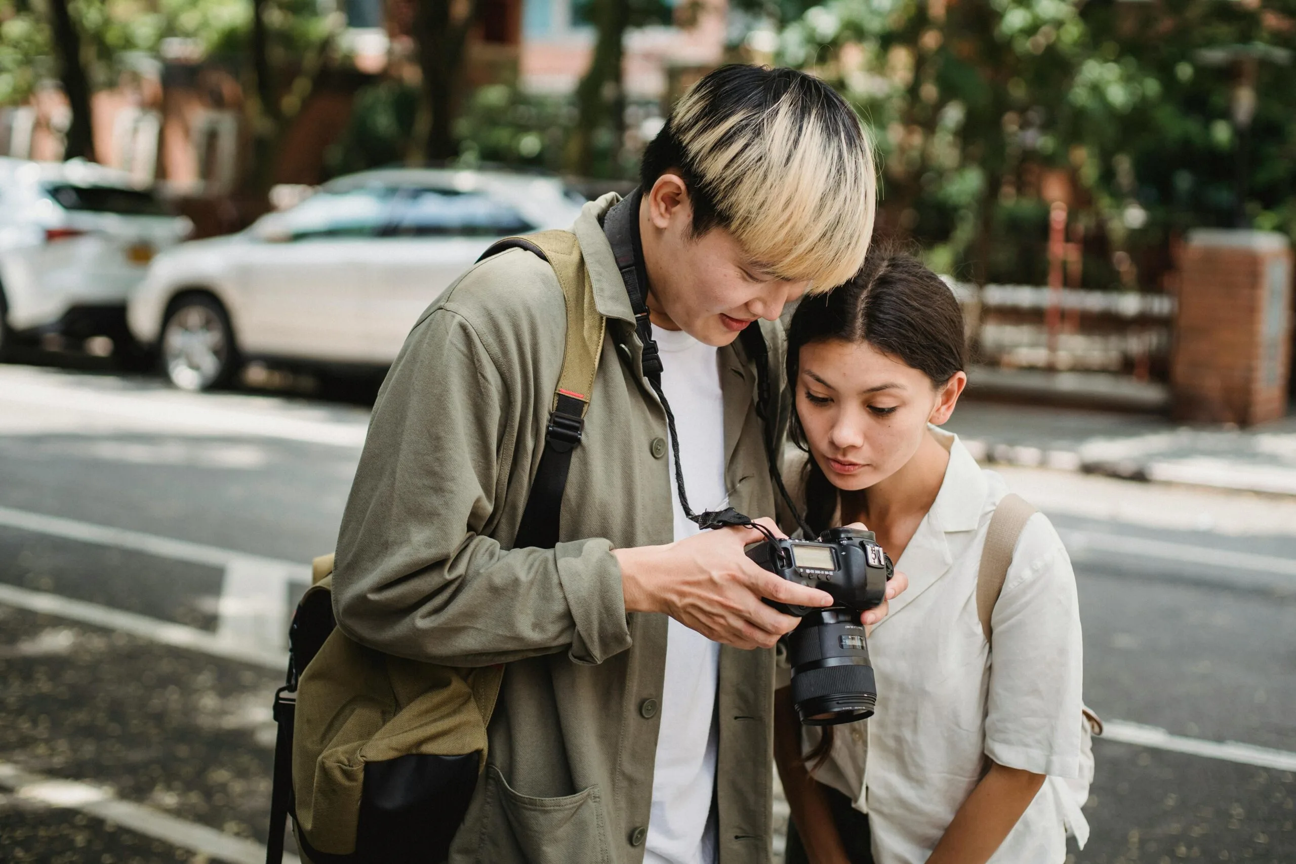 two tourists see the pictures in their camera